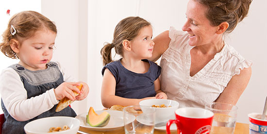 mother and children eating together